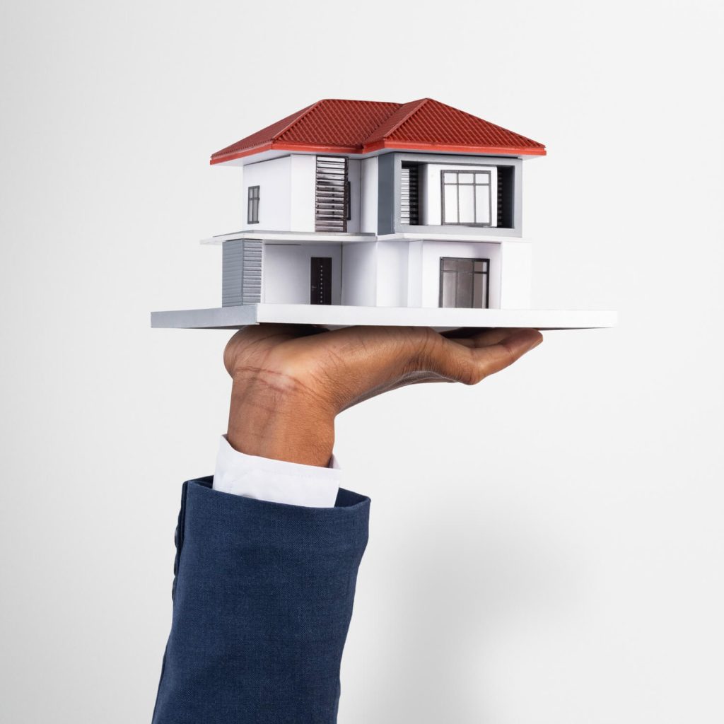 hand-holding-house-real-estate-property-model (1)